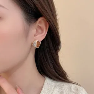 Elegant geometric rhombus stud earrings with caramel enamel and pearl white inlay in gold