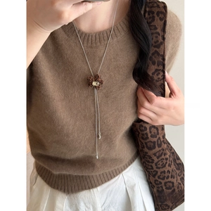 Close-up of leopard print floral pendant with 81cm adjustable silver-tone metal chain