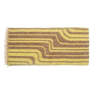 Detail of yellow and brown wave pattern scarf with soft textured fringe edges