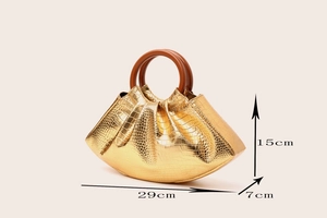 Detailed size guide of gold crocodile pattern handbag showing 29cm width and 15cm height