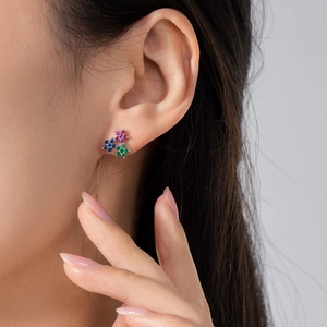 S925 sterling silver flower stud earrings with colorful cubic zirconia on a model