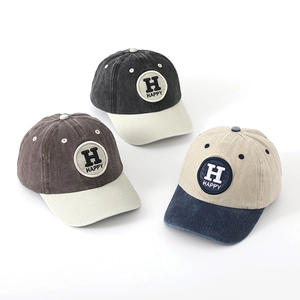 Detailed embroidery of Happy letters on three washed cotton kids baseball caps