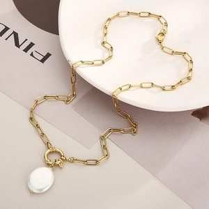 Detail of gold paperclip chain necklace with OT toggle clasp and baroque pearl pendant