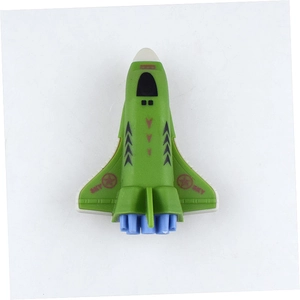 Close-up of green toy space shuttle with wings featuring red stars and SKY text
