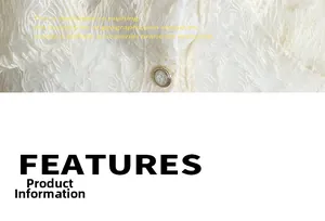 Close-up of white lace fabric texture and elegant gold embossed button details
