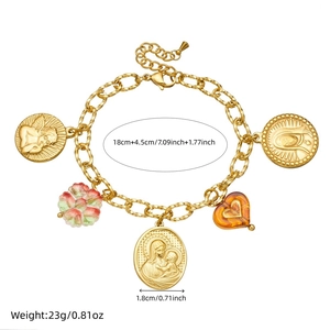 Gold stainless steel bracelet with relief charms including angels, flowers, and cross motifs