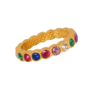 Golden titanium steel ring featuring colorful inlaid crystals and unique wavy edges