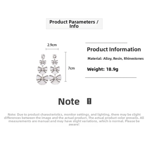 Detail view showing three-layer resin bow earrings with dimensions 2.9cm wide and 7cm high