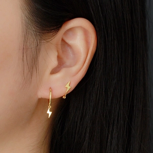 S925 sterling silver gold lightning bolt hoop earring and stud set on model ears