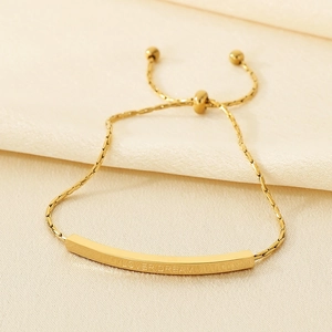 Minimalist adjustable gold stainless steel bracelet engraved with Lover Dream on silk