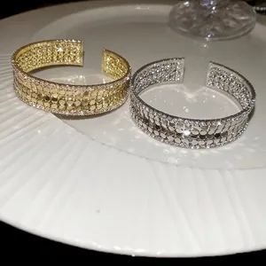 Sparkling multi-layer open cuff bracelets with cubic zirconia in gold and silver finish