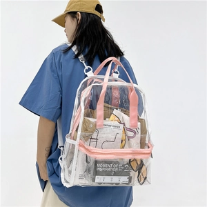 Transparent PVC backpack with pink straps showing large capacity for books and accessories