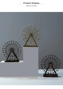 Detailed view of vintage Ferris wheel iron models in three metallic antique finishes
