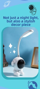 Creative astronaut desk lamp with flexible neck and eye-caring LED light on blue background