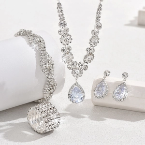 Elegant silver bridal jewelry set with sparkling rhinestones and drop pendants