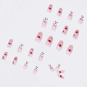 Translucent nude press-on nails with red hearts and leopard print patterns