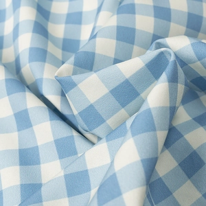 French style blue and white plaid ruffle blouse with tied details and puff sleeves