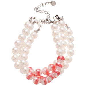 Three-layer stainless steel bracelet with white and pink patterned pearls on white background