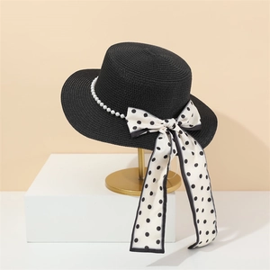 Elegant French black straw flat top hat with white pearl chain and polka dot bow detail