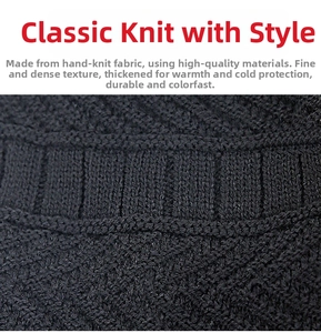 Close-up of black knitted winter beanie showing thick diamond pattern and ribbed texture