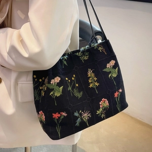 Large capacity black canvas tote bag with colorful floral embroidery and slim shoulder straps