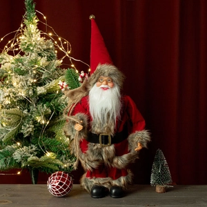 Detail of 12-inch Santa Claus figurine with red velvet suit, glasses and gift bag