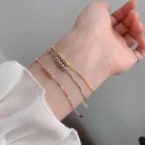Three-piece set of minimalist 925 sterling silver beaded bracelets in gold and rose gold