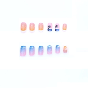 Summer beach press-on nails with sunset orange gradient and black coconut tree designs
