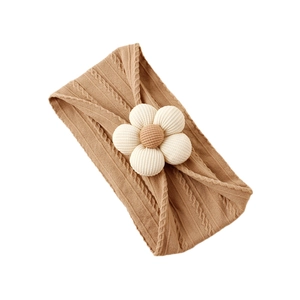 Soft nylon baby headband with knitted twist pattern and cream 3D floral decoration