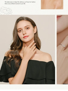 Detailed views of a minimalist silver star ring featuring delicate floral patterns on model