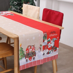 Christmas table runner with gnome and snowman prints on linen-textured fabric