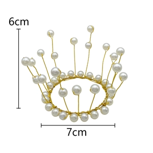 Detail of a 6cm high handmade pearl tiara with 7cm base for birthday and party decor