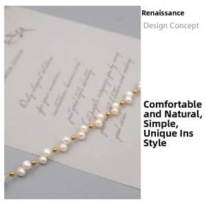 Macro shot of fine freshwater pearl bracelet with gold spacer beads and lobster clasp