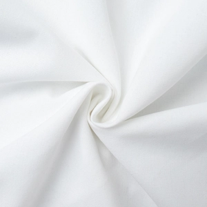 Detailed macro view of white cotton-linen fabric with soft texture and natural drape
