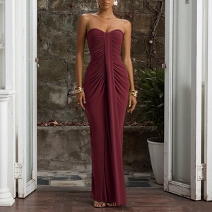 Detailed view of ruched burgundy bodycon dress featuring elegant backless design