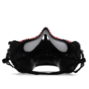 Detail view of red rhinestone mask featuring inner black lining and soft nose padding