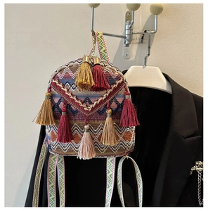Ethnic style woven mini backpack with colorful geometric patterns and decorative tassels