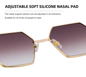 Close-up of adjustable silicone nose pads on gold polygon metal sunglasses