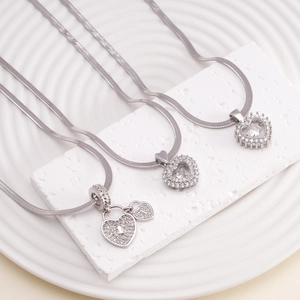 Elegant silver heart pendants with cubic zirconia inlay on sleek snake chain necklaces