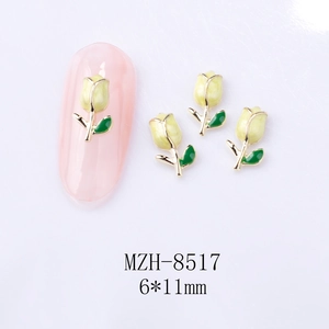 Detail of tulip nail art charm MZH-8517 with yellow petals and green leaves on pink nail