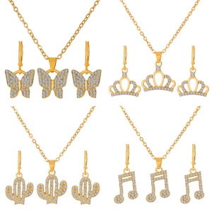 Sparkling gold jewelry sets with rhinestone butterfly crown cactus and music note charms