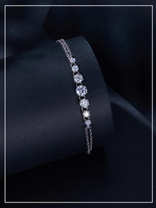 Detail view of seven graduated moissanite stones set on a S925 sterling silver chain