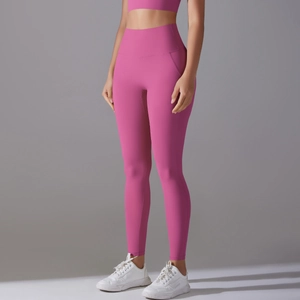 Detail of high waist yoga leggings in bright rose pink with butt-lifting slimming fit