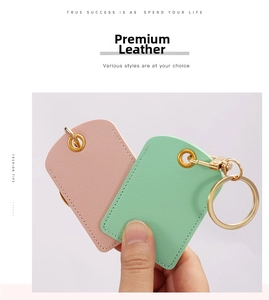 Detail of pink and green leather key fob covers with premium lychee grain texture