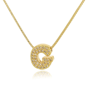 Detail of gold letter G pendant necklace with pavé cubic zirconia on box chain