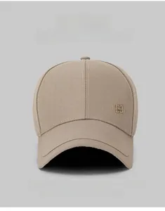 Close-up of geometric diamond embroidery on light khaki cotton twill baseball cap