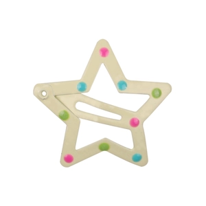 Detailed view of a star-shaped hair clip with colorful polka dots on a cream background