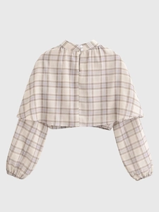 Detailed flat lay of a plaid cropped blouse with a stand collar and back button design