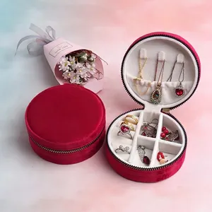Red velvet round zipper jewelry box with multi-slot storage for rings and necklaces
