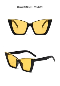 Detail of cat-eye sunglasses featuring golden metal trim and night vision yellow lenses